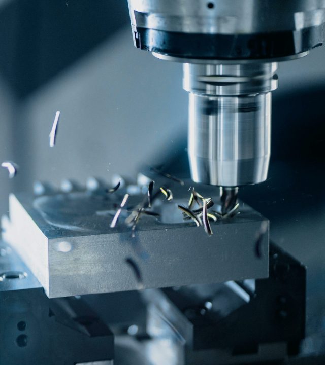 Close-up of a CNC milling machine working on metal for precise manufacturing.